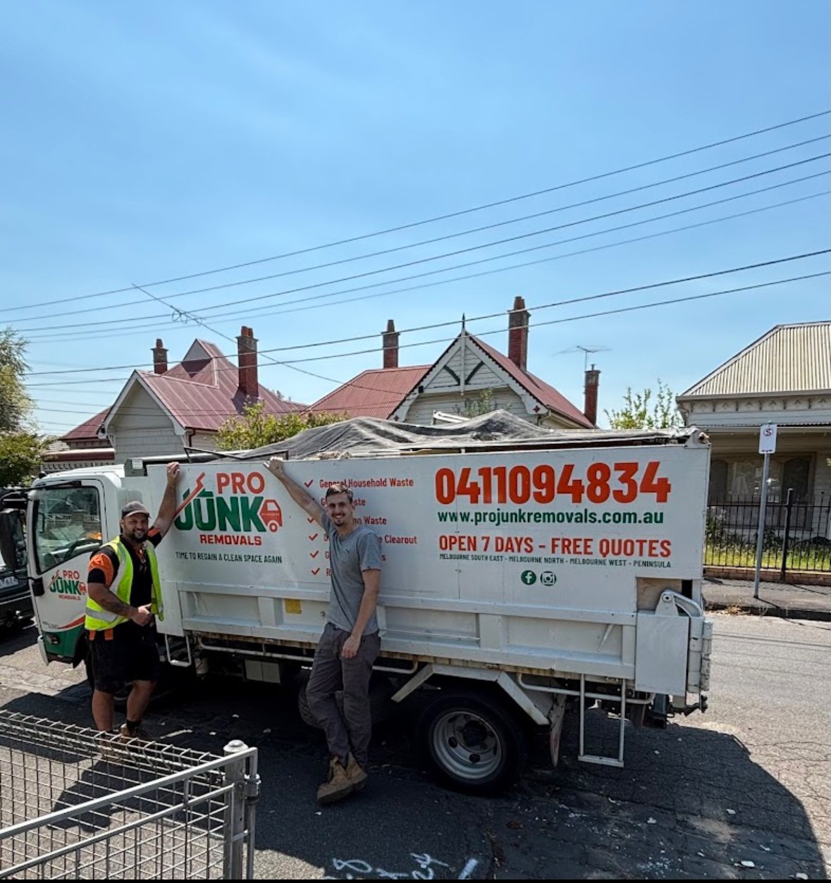 Pro Junk Removals team with truck on a residential street